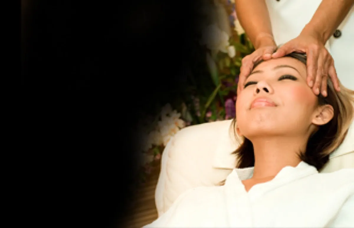 Client relaxing during a massage treatment